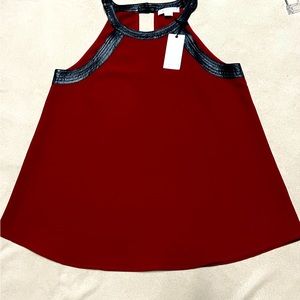 Cranberry flare halter top with faux leather trim.Small
